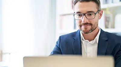 A business man working on a computer